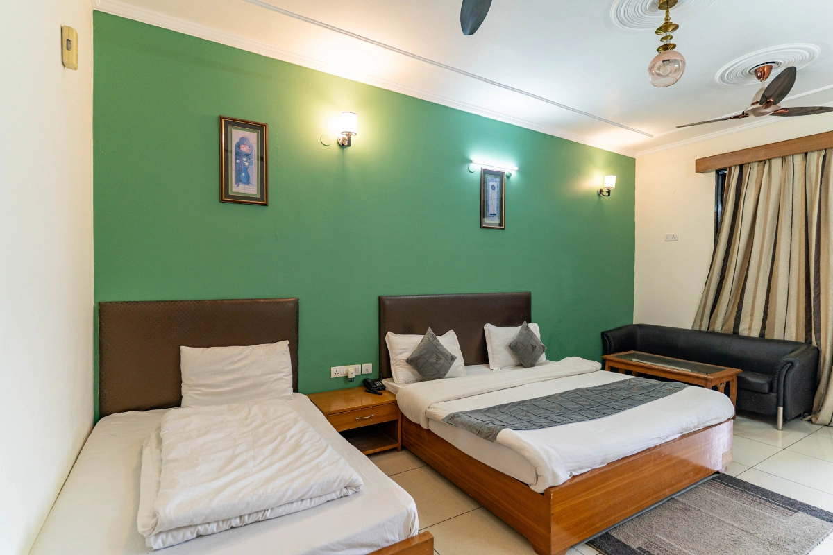 Twin beds and sofa in a Maya Regency room